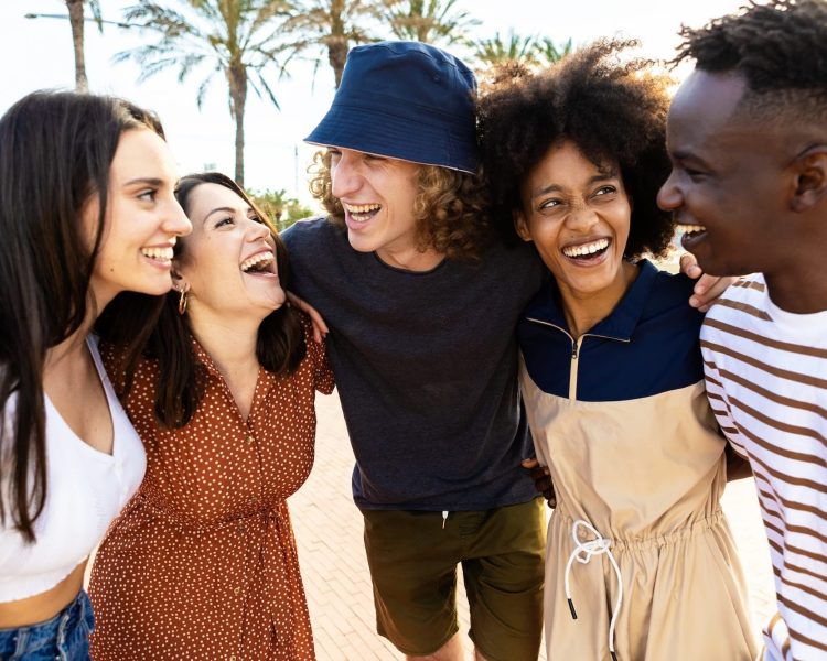 United young adult friends laughing together